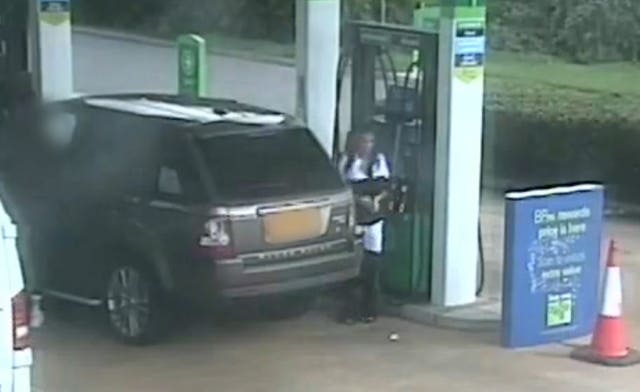 Katie Price at a petrol station after stepping out of the driver’s side of her Range Rover
