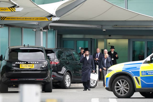 Two black SUVs wait outside the Windsor Suite at Heathrow Airport as Harry returned to London to visit the King after his father's cancer diagnosis was made public earlier this month