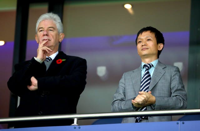 Club owner Guochuan Lai, pictured right, has terminated the contract of John Williams