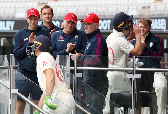England’s Jos Buttler is congratulated by captain Joe Root 