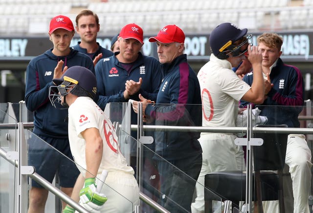 England’s Jos Buttler is congratulated by captain Joe Root