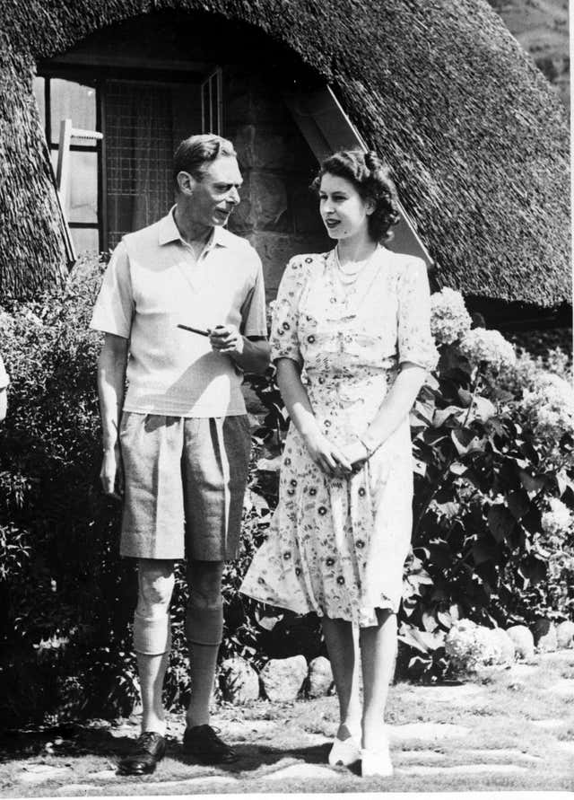 Princess Elizabeth with her beloved father George VI during a trip to South Africa in 1947 (PA)