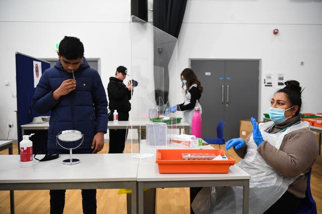 A student takes a lateral flow test at Hounslow Kingsley Academy in West London