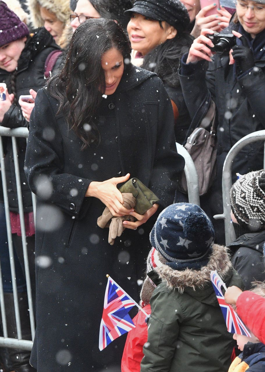 Meghan wraps up warm in boots and coat for trip to Bristol ...