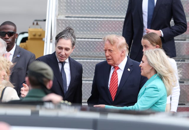 US President Donald Trump is greeted by Tánaiste Simon Harris as he arrives on Air Force One at Dublin Airport 