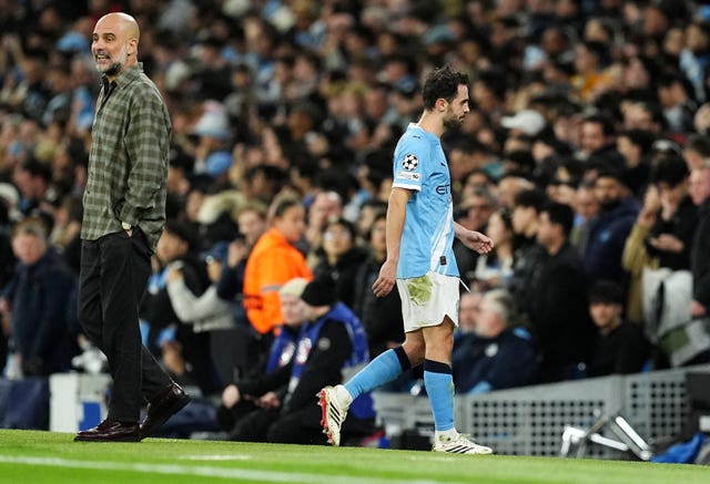 Bernardo Silva leaves the field after being shown a red card