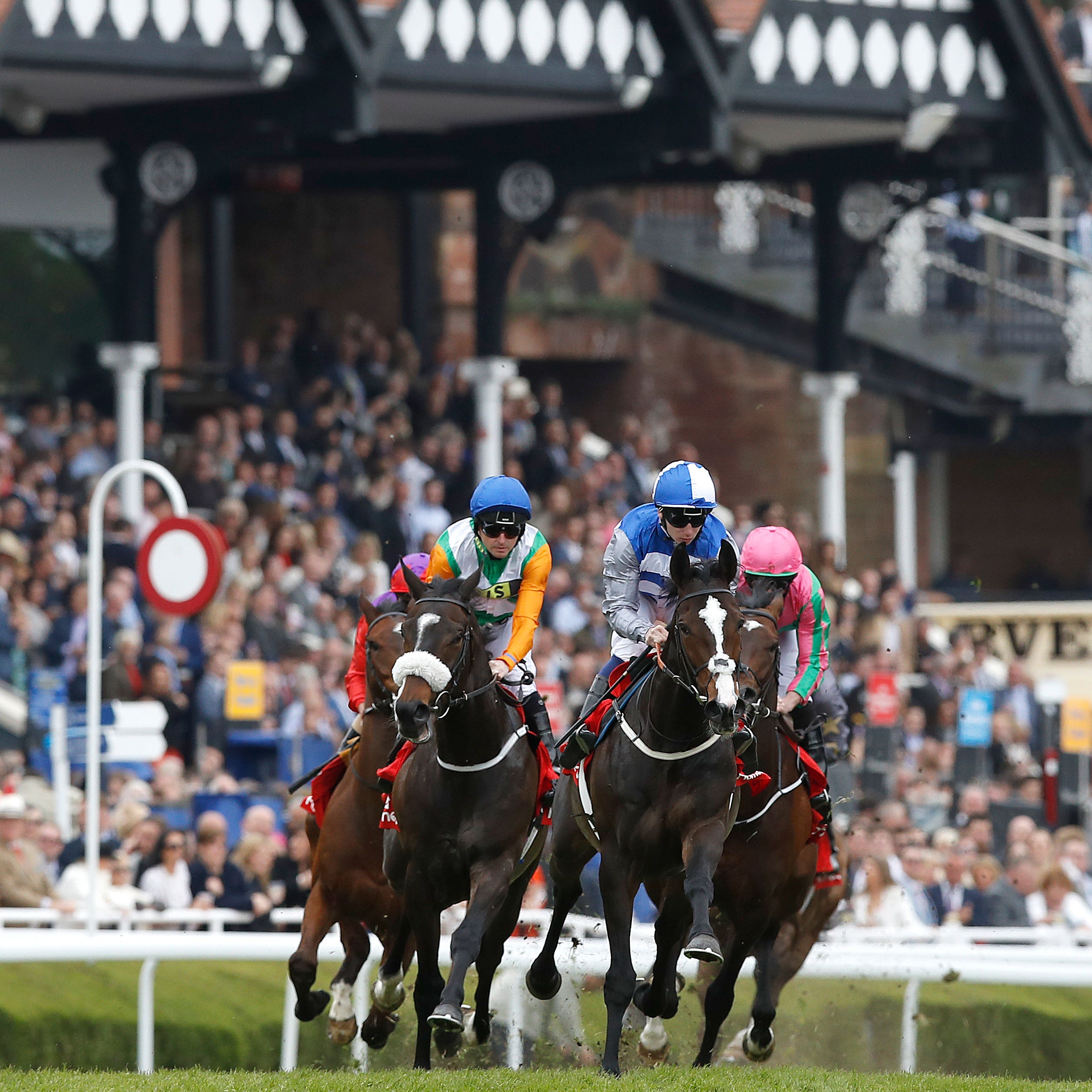 Eminent (centre) making the early running in the Huxley Stakes at Chester (Martin Rickett/PA)