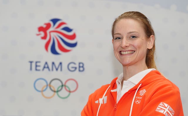 Bryony Page stood in front of a Team GB logo.