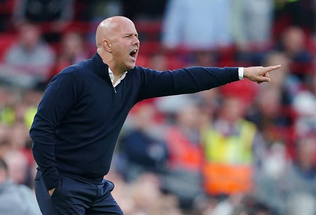 Liverpool manager Arne Slot points while on the touchline