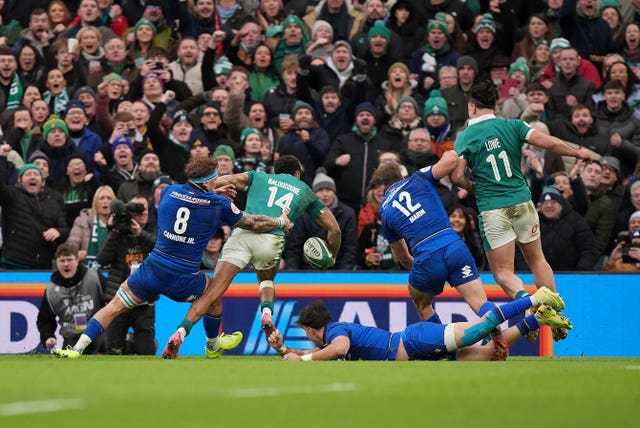 Robert Baloucoune, second left, scores Ireland’s decisive third try against Italy