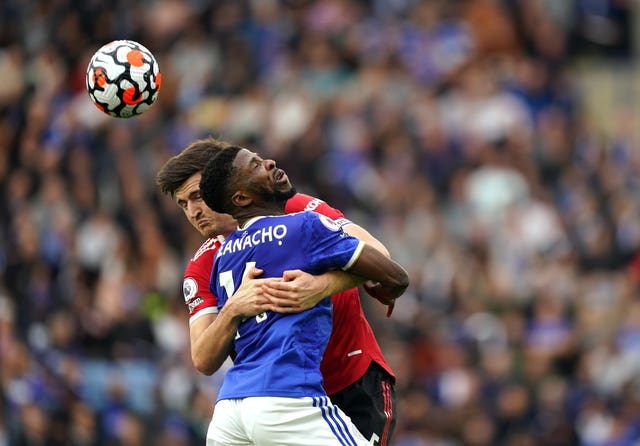 Harry Maguire (left) and Kelechi Iheanacho in action