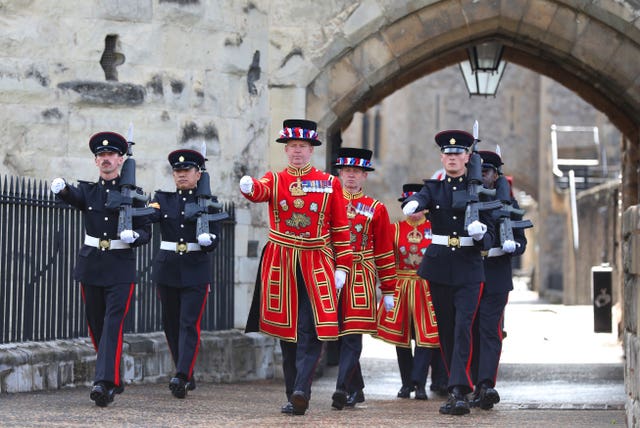 A march towards the West Door at the Tower of London