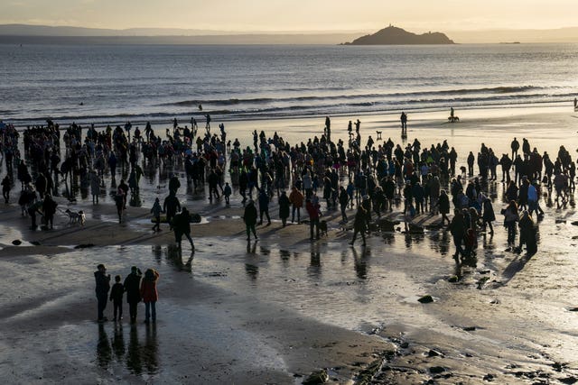 People gather on the beach to watch the Loony Dook New Year’s Day dip in the Firth of Forth at Kinghorn