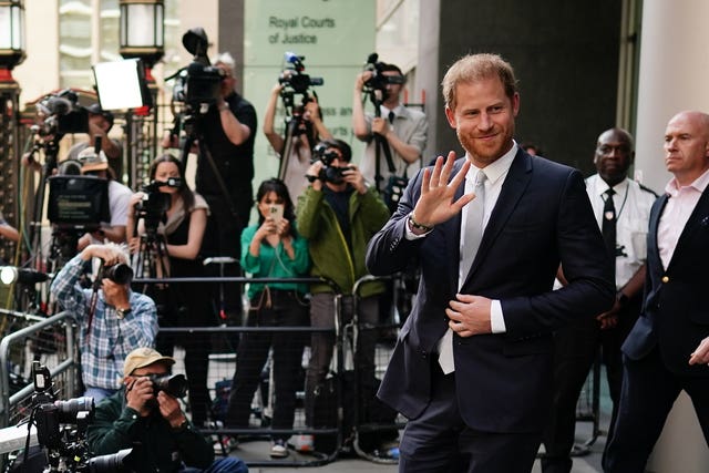 The Duke of Sussex waves as he leaves the Rolls Buildings in central London in June