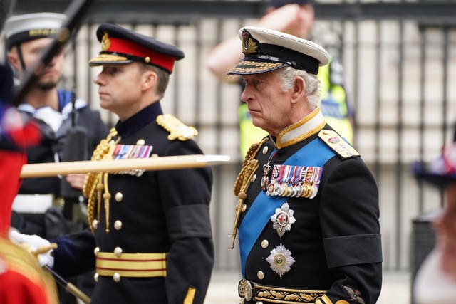 The King, who served in the Navy, wore a Royal Navy no. 1 tailcoat with several decorations and medals.