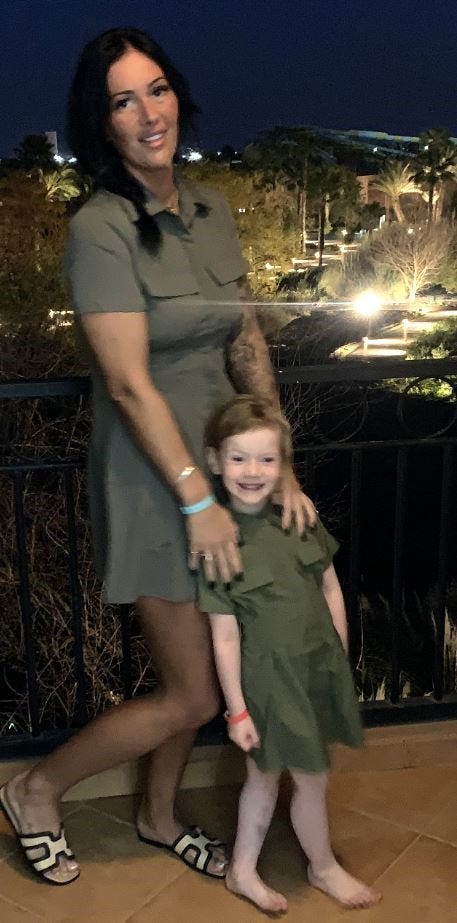 Handout photo of Emma Conn and daughter Mayci posing for a photo and smiling