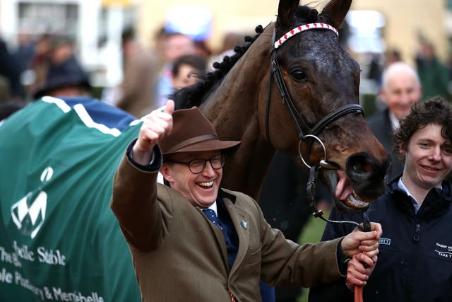 Trainer Harry Whittington celebrates after Simply The Betts wins the Brown Advisory & Merriebelle Stable Plate Handicap Chase at the  Cheltenham Festival 