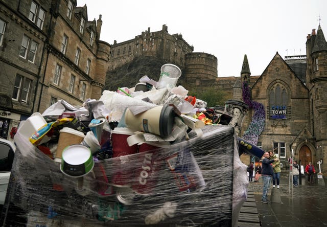 Overflowing bin with Edinburgh Castle in the background