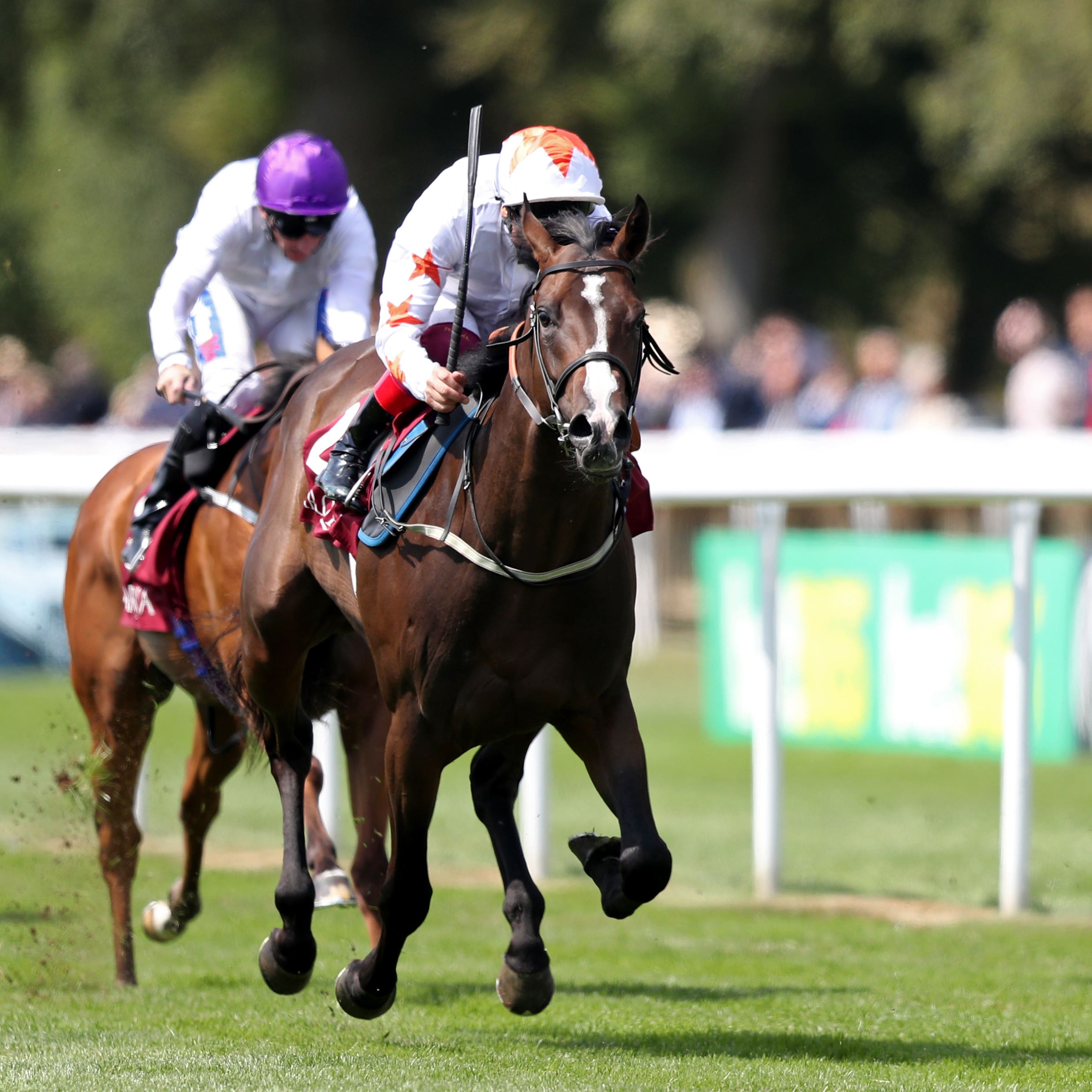 Advertise (centre) wins the July Stakes at Newmarket (
