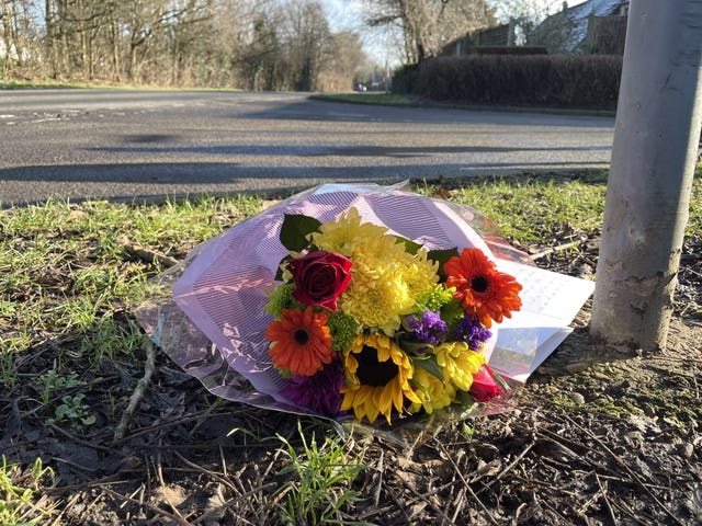 Flowers left near to the scene of a collision where two children died in Pitsea, Essex