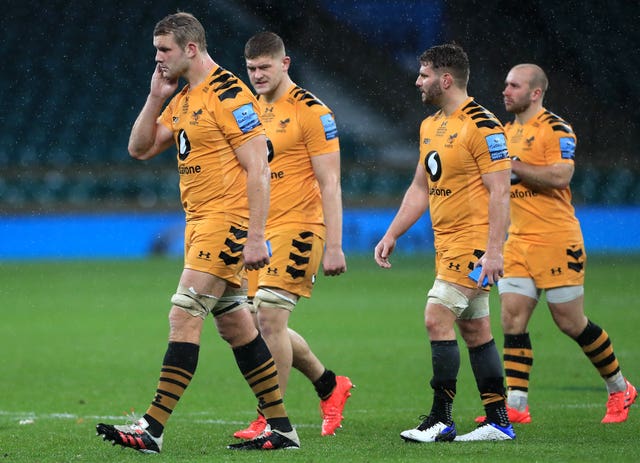 Joe Launchbury (left) appears dejected with his Wasps team-mates after the final whistle 