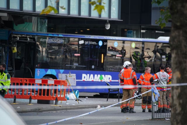 Emergency services at the scene of a bus crash at the City Tower building close to Manchester’s Piccadilly Gardens Metrolink stop