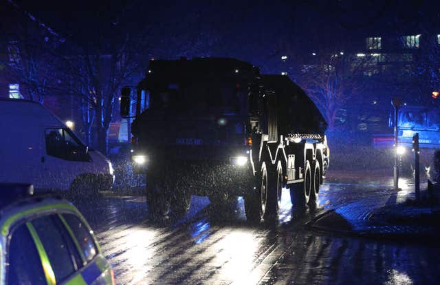 A convoy of police and military vehicles leave Salisbury District Hospital