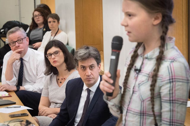 Environment Secretary Michael Gove, left, former Labour leader Ed Miliband, 2nd right, and Swedish climate activist Greta Thunberg, right, discuss the need for cross-party action to address the climate crisis