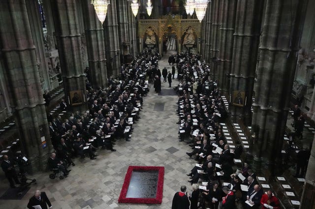 Guests and officials begin to take their places at Westminster Abbey