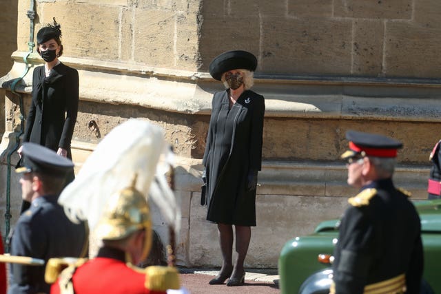 The Duchess of Cambridge and the Duchess of Cornwall watching the procession at the Galilee Porch of St George’s Chapel, Windsor Castle, Berkshire, during the funeral of the Duke of Edinburgh