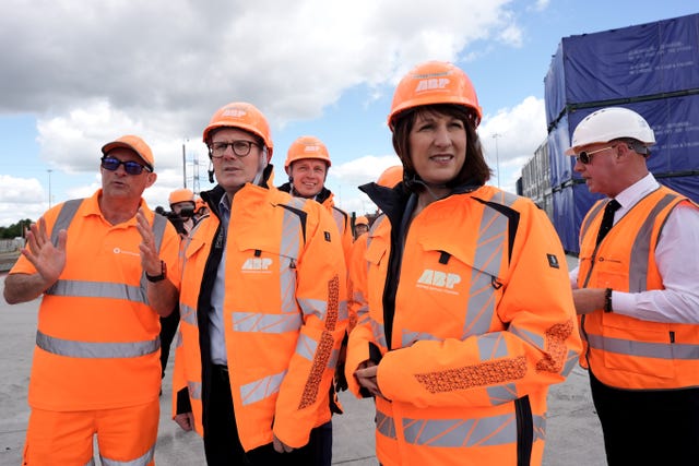 Labour Party leader Sir Keir Starmer and shadow chancellor Rachel Reeves wearing orange hard hats and hi-vis jackets during a visit to Ocean Gate, Eastern Docks, in Southampton