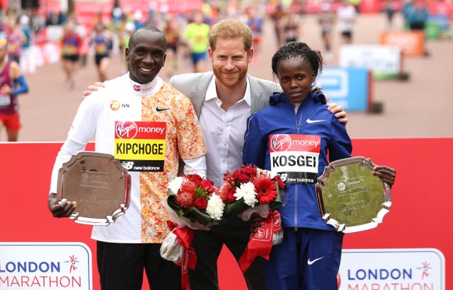 Harry with the men's winner Eliud Kipchoge and women’s winner Brigid Kosgei