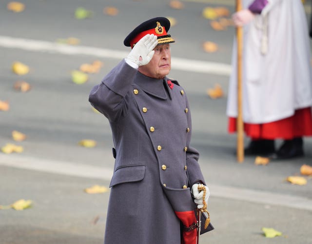Charles saluting at the Cenotaph in Whitehall 