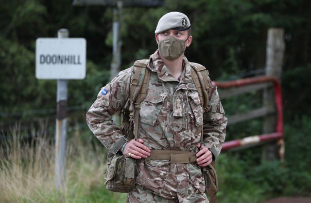 A soldier from the Royal Scots Dragoon Guards wears a face mask during Exercise Solway Eagle at the Kirkcudbright training area