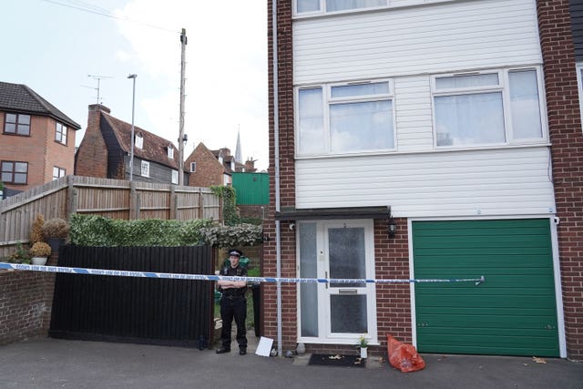 Police officer outside the house