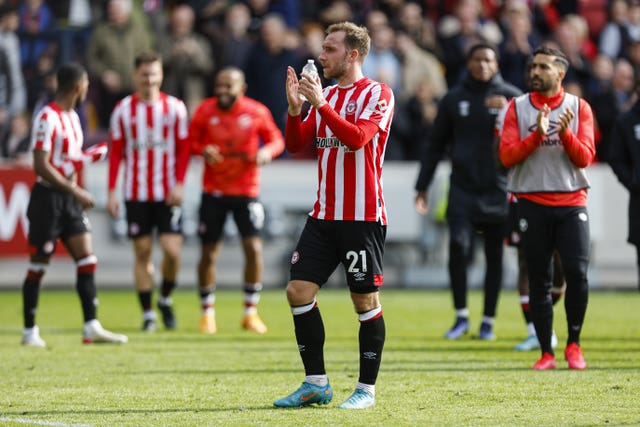 Brentford’s Christian Eriksen applauds the fans after his side took another huge step to Premier League safety after beating West Ham 2-0 
