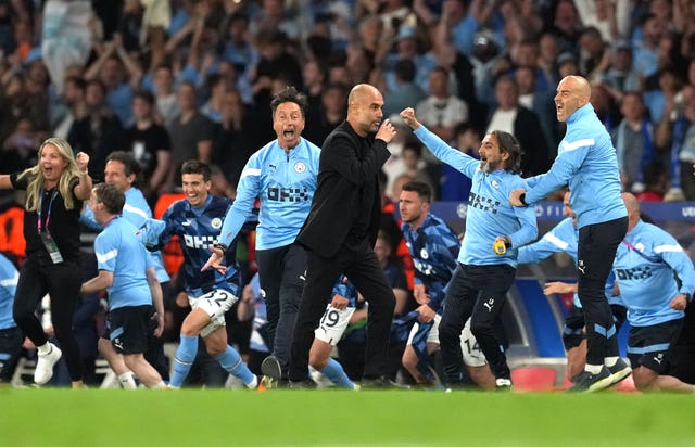 Pep Guardiola, centre, and his coaching staff react at the final whistle in the Champions League final