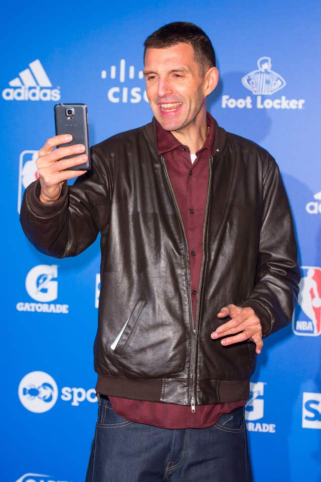 Tim Westwood holding up a mobile phone