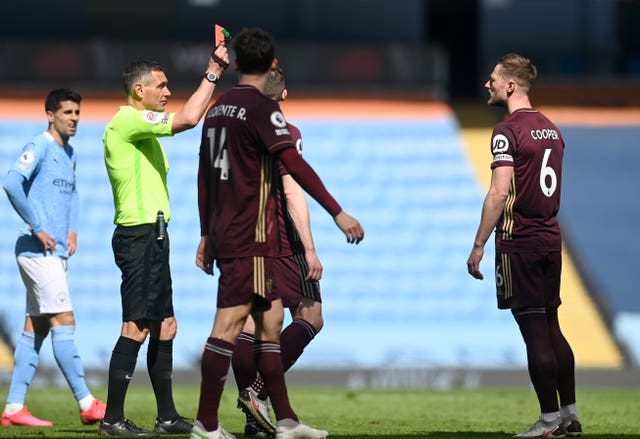 Cooper, right, was shown a straight red card in last month's win at Manchester City