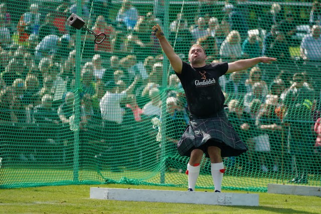 An athlete tosses the hammer during the field events 