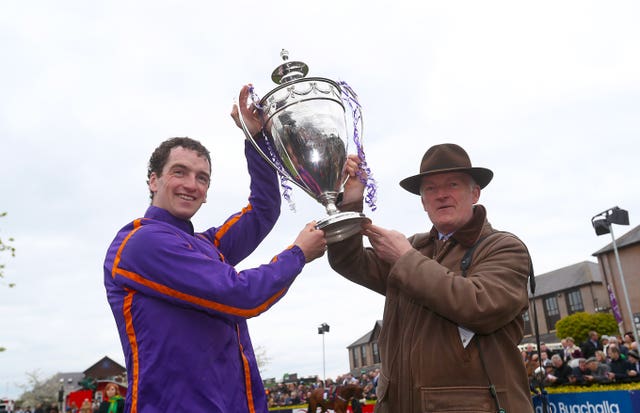 Patrick and Willie Mullins hold the trophy aloft after last year's triumph