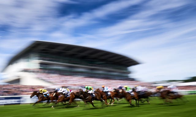 Ornate, ridden by jockey Phil Dennis, on the way to winning the Investec Dash Handicap during Derby Day at Epsom. The David Griffiths-trained six-year-old, left, made virtually every yard of the running to claim a surprise victory by a neck