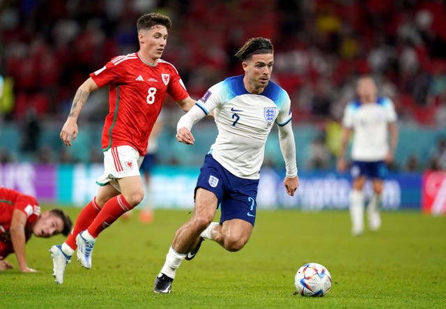 Harry Wilson, left, in action against England’s Jack Grealish at the 2022 World Cup