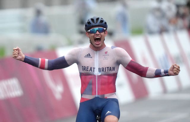 Ben Watson celebrates winning the men's C1-3 road race