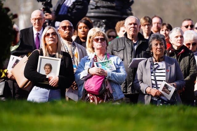 People attend a ceremony marking the fifth anniversary of the Covid-19 pandemic at the National Covid Memorial Wall in London