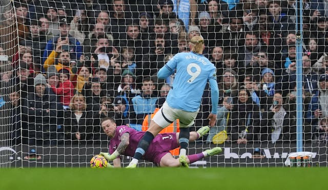 Jordan Pickford saves a penalty from Erling Haaland