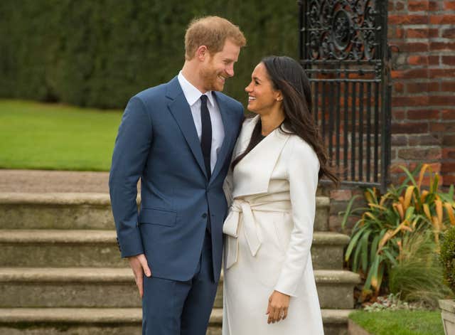 Prince Harry and Meghan Markle in the Sunken Garden at Kensington Palace, London, after the announcement of their engagement (Dominic Lipinksi/PA)