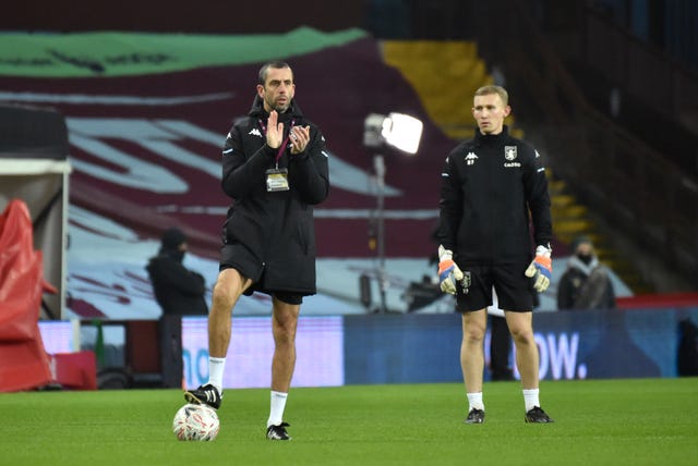 Aston Villa Under-23 manager Mark Delaney (left) watches over the warm-up