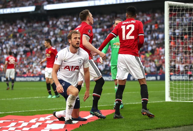 Tottenham forward England captain Harry Kane (left).