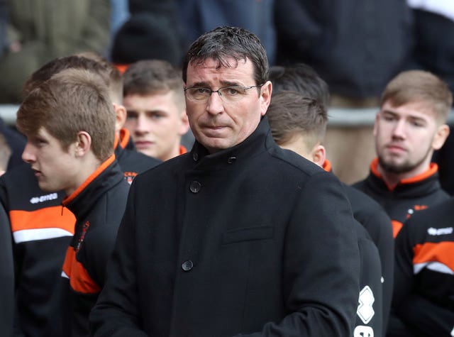 Blackpool manager Gary Bowyer looks emotional as Jimmy Armfield's funeral cortege  passes through Bloomfield Road